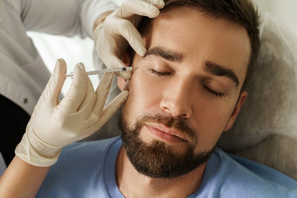 Female,Doctor,And,Male,Client,During,Filler,Injections,In,Aesthetic How to Find the Best Botox Doctor Near Eagle, Idaho (And Why You Shouldn’t Settle!)