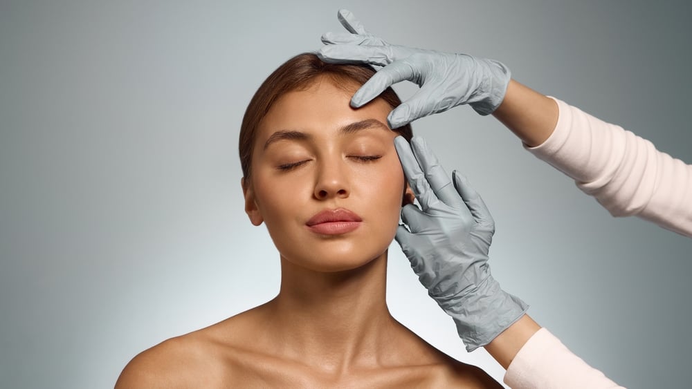 Woman,With,Eyes,Closed,Touched,By,Doctor,Hands,Showing,Calmness What Happens During a Consultation for a Facial Balancing Appointment in Meridian, Idaho?