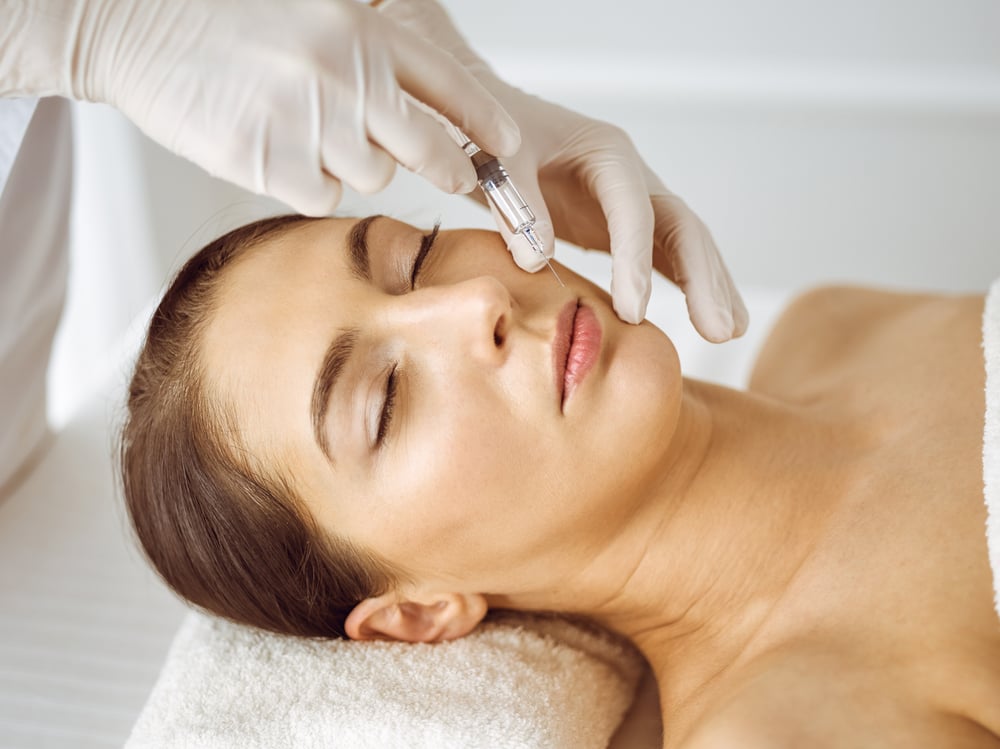 Beautician,Doing,Beauty,Procedure,With,Syringe,To,Face,Of,Young Botox for Mouth Lines