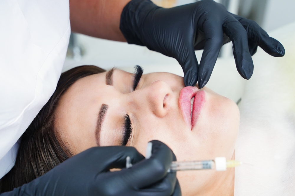 Doctor,Cosmetologist,Prepares,The,Patient,For,The,Lip,Augmentation,Procedure Your Quick Guide to Your First Lip Filler Appointment Near Eagle, Idaho