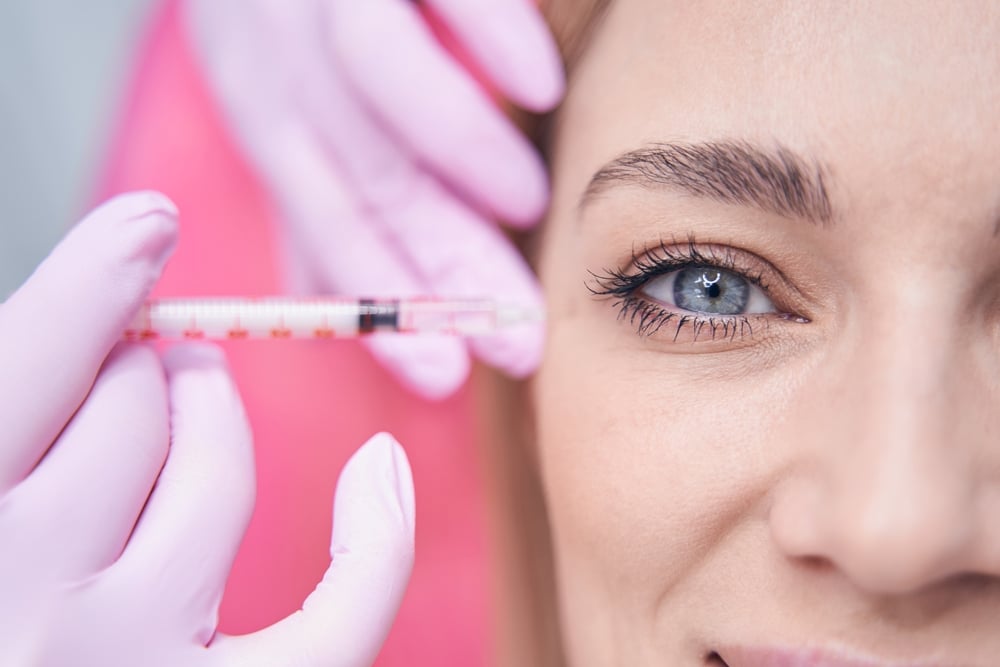 Aesthetic,Clinic,Client,Being,Treated,For,Crows,Feet,By,Dermatologist Under-Eye Filler Treatments in Boise, Idaho: Cost, Safety, and Results