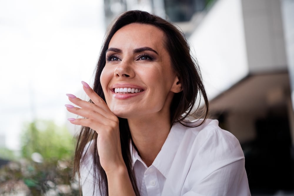 Photo,Of,Gorgeous,Cheerful,Creative,Minded,Person,Arm,Touch,Face Non-Surgical Facelift in Boise, Idaho: Pricing, Results, and Recovery Time