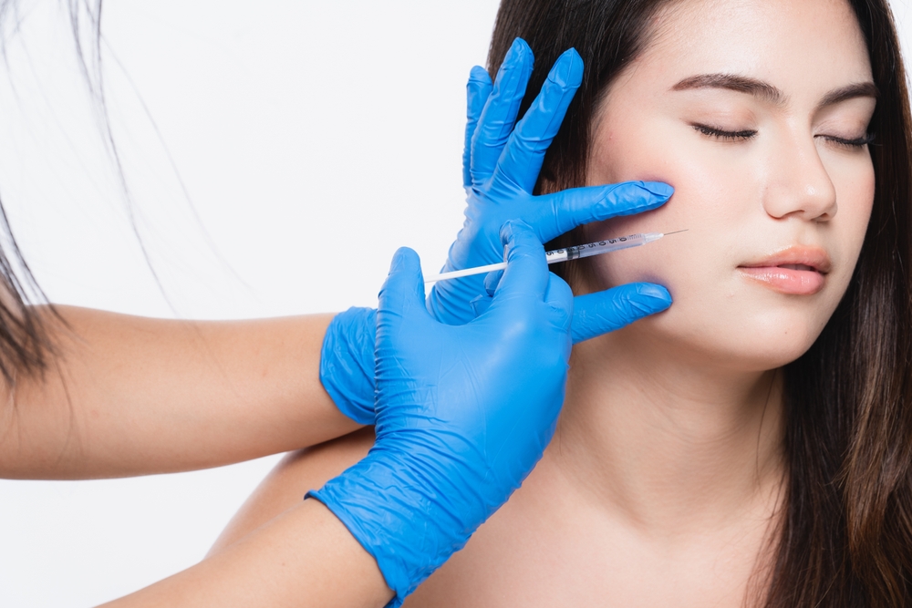 A,Young,Beautiful,Woman,For,Beauty,Injection,With,A,Syringe